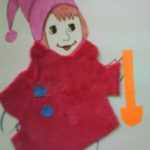 Рисованная девочка в тканевом пальто с бумажными пуговицами